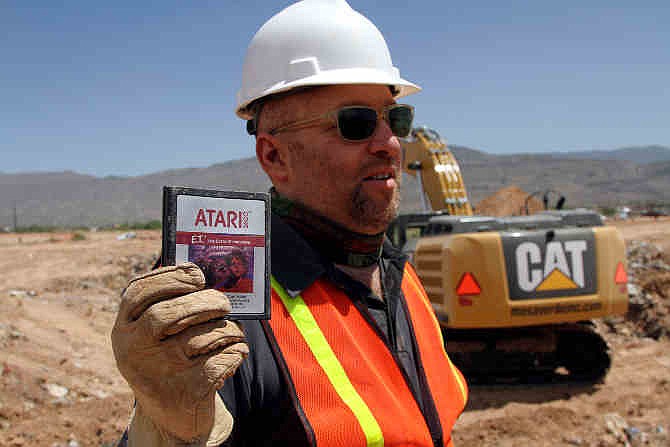 Film Director Zak Penn shows a box of a decades-old Atari 'E.T. the Extra-Terrestrial' game found in a dumpsite in Alamogordo, N.M., Saturday, April 26, 2014. Producers of a documentary dug in a southeastern New Mexico landfill in search of millions of cartridges of the game that has been called the worst game in the history of video gaming and were buried there in 1983