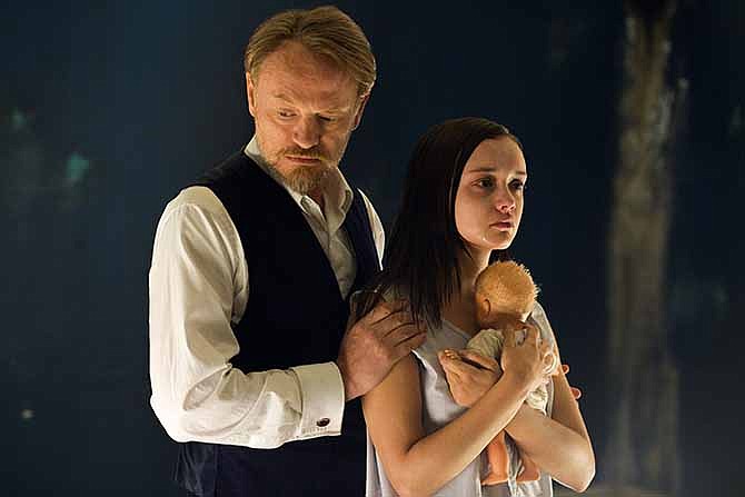 This image released by Lionsgate shows Jared Harris, left, and Olivia Cooke in a scene from "The Quiet Ones."