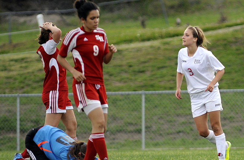 Jefferson City's Natalie Vance makes her way past the dejected defense of Sedalia Sacred Heart while rejoining her teammates after scoring a second-half goal in Friday's game at the 179 Soccer Park.