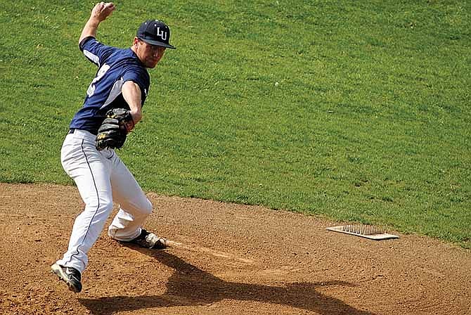 Lincoln's Ian Fuemmeler, the Game 2 starter in Saturday's doubleheader at Lincoln Field, works to the plate against a Southwest Baptist batter.