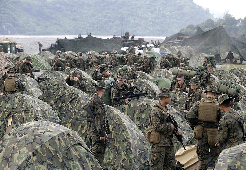 U.S. Marines fix their tents as they arrive at Crow Valley, Tarlac province in northern Philippines, to take part in a 2012 joint U.S.-Philippines amphibious landing exercise.
