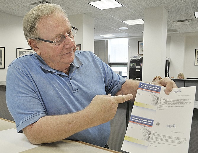 Cole County Clerk Marvin Register shows the new voter identification card that will be arriving in residents' mailboxes later this week. Up until now, voter cards have been a solid color so Register wants people to know that this new design is a legitimate card and not a solicitation for information. The new card is shown below.