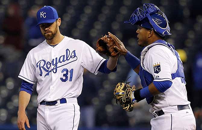 Kansas City Royals relief pitcher Louis Coleman (31) is congratulated by catcher Salvador Perez, right, following a baseball game against the Toronto Blue Jays in Kansas City, Mo., Tuesday, April 29, 2014. The Royals won 10-7.