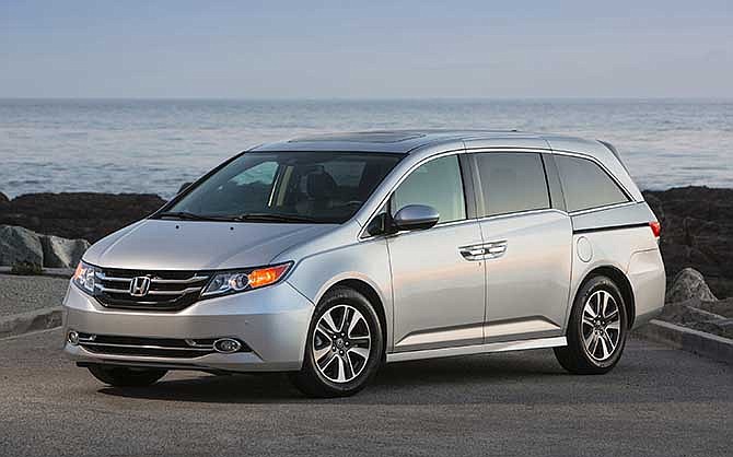 This undated photo provided by Honda shows the 2014 Honda Odyssey. 