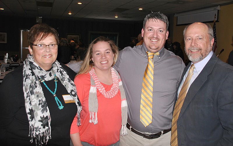 (From right) Bob Hansen, winner of the Callaway County chapter of the Mizzou Alumni Association's Outstanding Alumnus Award with his family: son Matt, daughter-in-law Tami and wife Linda. Hansen received the award due to his lifelong commitment to service.