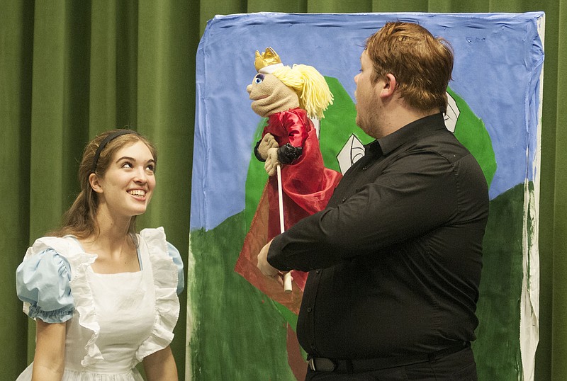 Alice, played by William Woods University student Bailey Campanini, bows to the Queen of Hearts, played by student Stephen Chamineak, Thursday inside the Kemper Arts Center as the students prepared for their upcoming production of "Alice in Wonderland." The children's play will be Saturday at 1 p.m. in Dulany Auditorium.