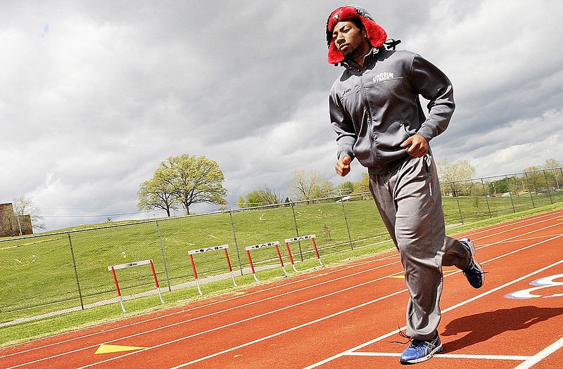 Wesley Best prepares for his running events as he and fellow student athletes from Lincoln University go through practice earlier this week at Dwight T. Reed Stadium for the MIAA Outdoor Track and Field Championships, which begin today.