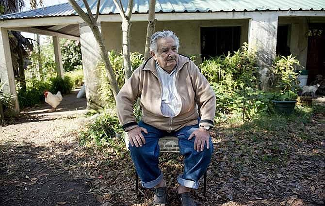 Uruguay's President Jose Mujica sits outside his home during an interview on the outskirts of Montevideo, Uruguay, Friday, May 2, 2014. Mujica said Friday that his country's legal marijuana market will be much better than Colorado's, where he says the rules are based on "fiction" and "hypocrisy" because the state loses track of the drug once it's sold and many people fake illnesses to get prescription weed. Mujica says this won't be allowed in Uruguay, where the licensed and regulated market will be much less permissive with drug users.