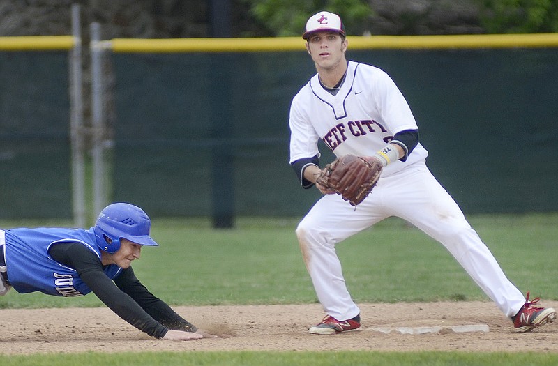 Tyler Adams of South Callaway slides back to second base where Jake Walker of Jefferson City waits for a throw during Thursday's game at Vivion Field.