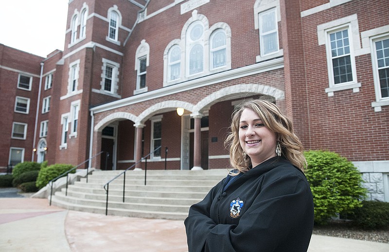 Alex Burns, William Woods University freshman, poses for a photo wearing her authentic Ravenclaw cloak outside Dulany Auditorium on Thursday. Burns is the founder of West Woods, a Quidditch team combining William Woods and Westminster College students.