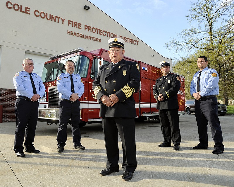 Cole County Fire Protection District Fire Chief Donnie Braun, center, and his sons, from left, Steve, Gary, Alan, and grandson Justin Braun.