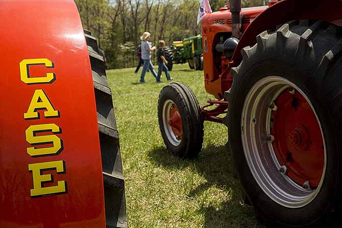 Two antique Case tractors sit on display Saturday afternoon at the Show-Me State Antique Tractor and Farm Toy Show at Apple Creek Farm near Centertown, Mo.