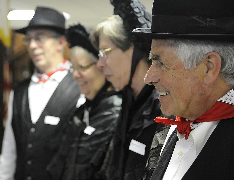 Several members of the German group pose during their visit to Taos on Sunday. The attire is unique to their hometown of Twist, a town of about 10,000 beside the Dutch border.