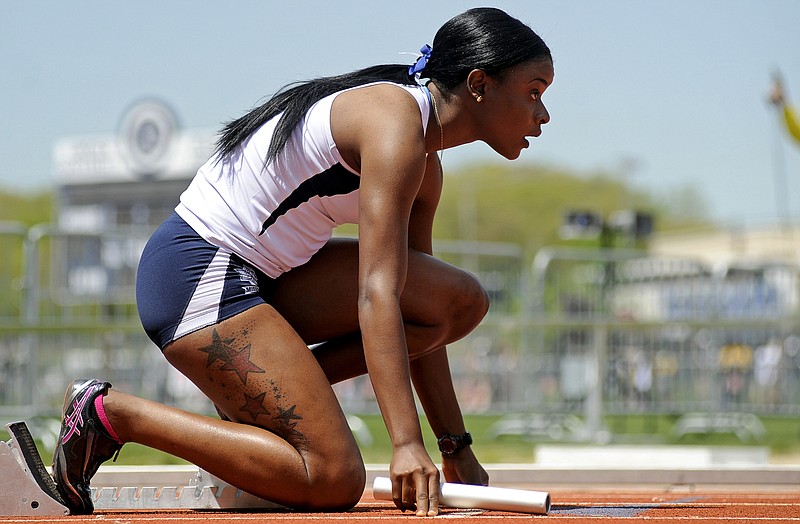 Lincoln sprinter Ladonna Richards takes her mark as she waits for the starter's next command before running the first leg for the Blue Tigers in the 4x100-meter relay during Sunday's action in the MIAA Track and Field Championships at Dwight T. Reed Stadium. Lincoln won the event on its way to claiming team honors.