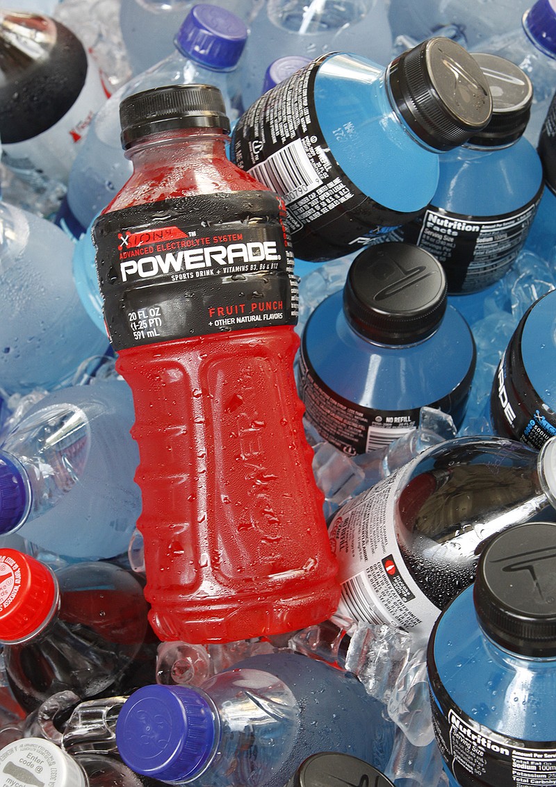 Bottles of Powerade sports drink and other Coca-Cola products are chilled over ice in store. A controversial ingredient, brominated vegetable oil, is being removed from some Powerade sports drinks.