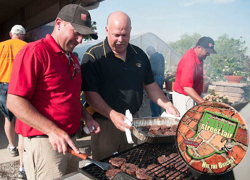 Nathan Real, owner of Truescape Landscaping, LLC, prepares hamburgers along with Callaway County Presiding Commissioner Gary Jungermann Tuesday evening during Business After Hours. Truescape and the Callaway County Commission hosted the barbecue at the landscaping business. The Fulton Street Fair Committee kicked off its button sale at the event. Buttons act as raffle tickets for prizes and work as incentives for other products and activities during the Street Fair.