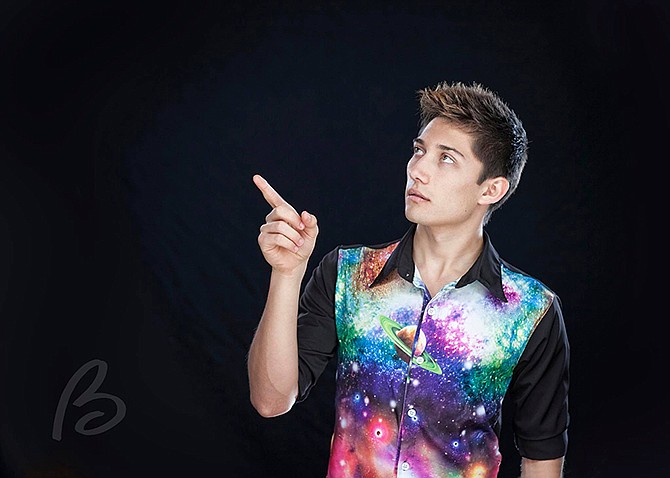 Keeping with his colorful personality, Garrett Crouse wore this planetary shirt for his Eugene High School senior photo, in honor of his future major in astro-physics.