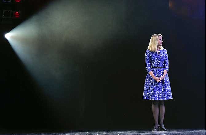  In this Tuesday, Jan. 7, 2014, photo, Yahoo president and CEO Marissa Mayer speaks during a keynote address at the International Consumer Electronics Show, in Las Vegas.