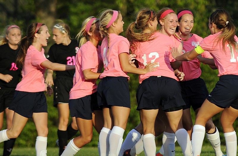 Katlyn Cowell (third from right) celebrates with her Helias teammates following her first-half goal in Wednesday night's game against Jefferson City at the 179 Soccer Park.