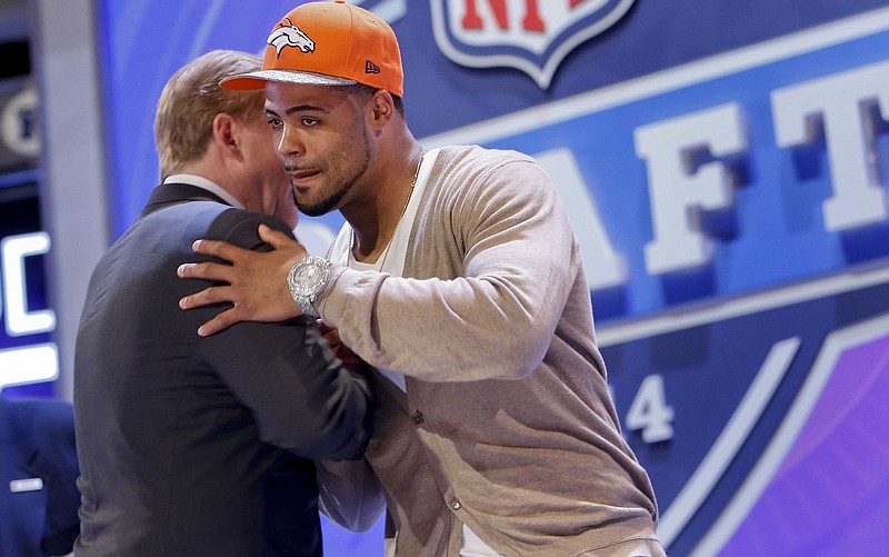 Indiana wide receiver Cody Latimer greets NFL commissioner Roger Goodell after being selected by the Denver Broncos as the 56th pick during the second round of the 2014 NFL Draft, Friday, May 9, 2014, in New York. 