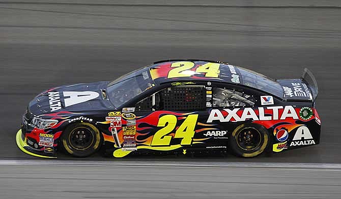 Jeff Gordon (24) takes a lap during a NASCAR Sprint Cup Series auto race at Kansas Speedway in Kansas City, Kan., Saturday, May 10, 2014.