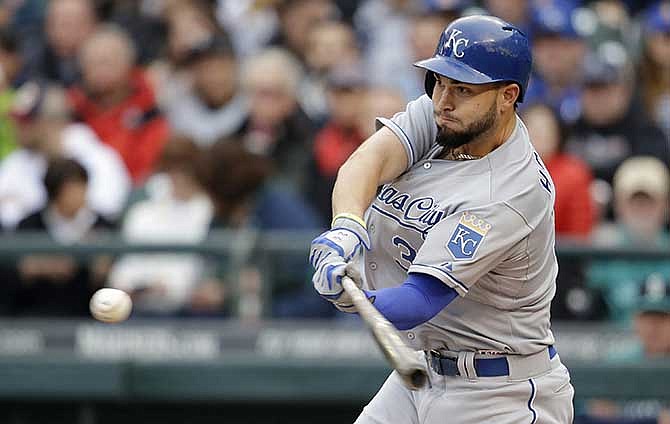Kansas City Royals' Eric Hosmer singles against the Seattle Mariners in the first inning of a baseball game Friday, May 9, 2014, in Seattle. 
