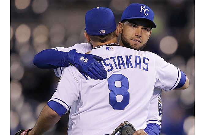Moustakas leads Royals past Rockies