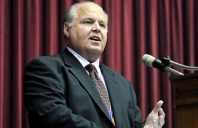 This May 14, 2012, photo shows conservative commentator Rush Limbaugh speaking during a ceremony inducting him into the Hall of Famous Missourians in the state Capitol in Jefferson City, Mo.