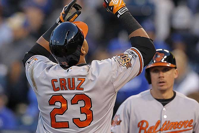 Baltimore Orioles' Nelson Cruz (23) gestures following his two-run home run off Kansas City Royals starting pitcher Yordano Ventura during the fourth inning of a baseball game at Kauffman Stadium in Kansas City, Mo., Thursday, May 15, 2014. 