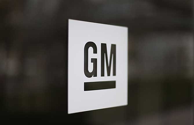 This Friday, May 16 2014 photo shows the General Motors logo at the company's world headquarters in Detroit.