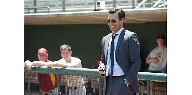 This photo released by Disney Enterprises, Inc. shows Jon Hamm, right, as sports agent JB Bernstein in a scene from the Walt Disney Pictures' "Million Dollar Arm."