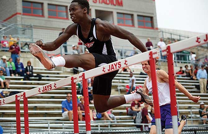 Austin Chiagrom of Jefferson City takes the lead around the halfway point during the boy's 110-meter hurdles Saturday at the Class 4 District 5 meet at Adkins Stadium.