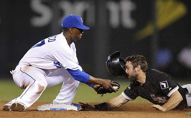 Kansas City Royals second baseman Pedro Ciriaco, left, tags out Chicago White Sox's Adam Eaton on an attempted steal during the ninth inning of a baseball game at Kauffman Stadium in Kansas City, Mo., Tuesday, May 20, 2014.