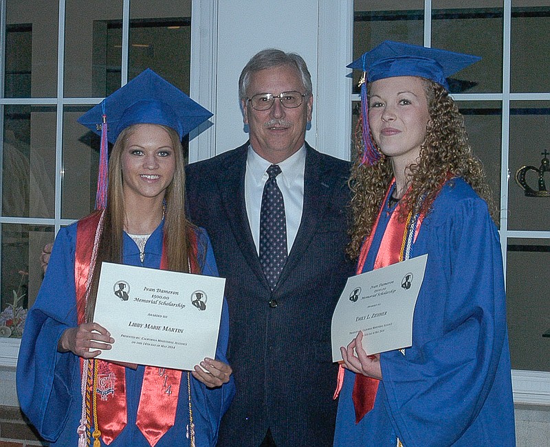 California First Baptist Church Pastor Greg Morrow, center, with the 2014 Ivan Dameron Memorial Scholarship recipients, Libby Martin, right, and Emily Ziehmer, left. The scholarship is given each year at the CHS Baccalaureate service.