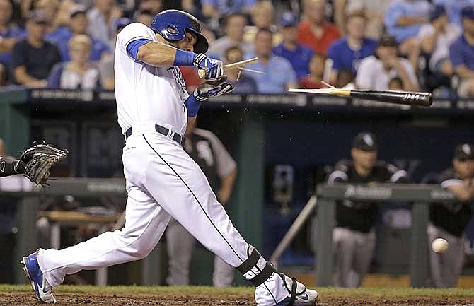 Kansas City Royals' Alex Gordon breaks his bat as he grounds out during the sixth inning of a baseball game against the Chicago White Sox on Wednesday, May 21, 2014, in Kansas City, Mo.