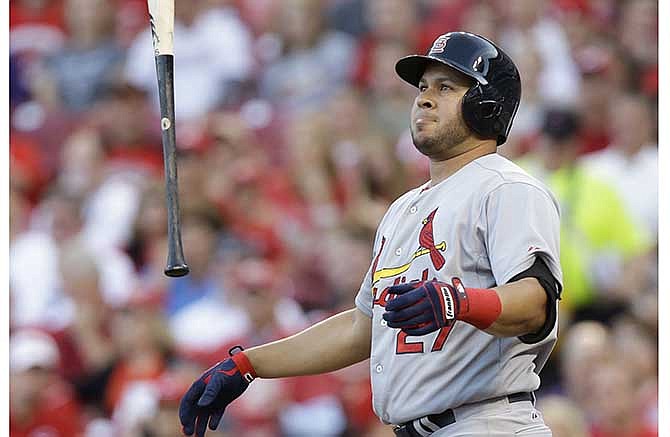 St. Louis Cardinals' Jhonny Peralta reacts after striking out against Cincinnati Reds starting pitcher Homer Bailey in the fourth inning of a baseball game, Friday, May 23, 2014, in Cincinnati.