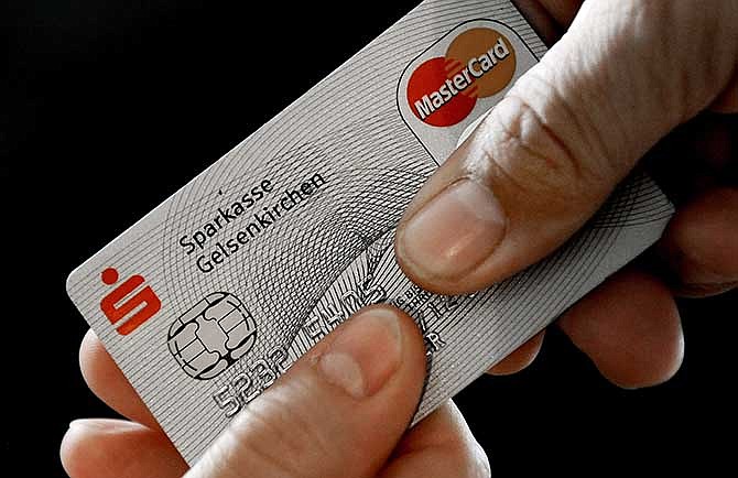 In this Nov. 18, 2009 file photo, a Mastercard chip-based credit card is posed for a photo in Gelsenkirchen, Germany.