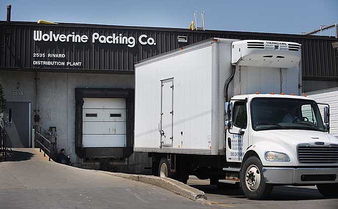A truck pulls away from the dock at Wolverine Packing Company in Detroit on May 19, 2014. 