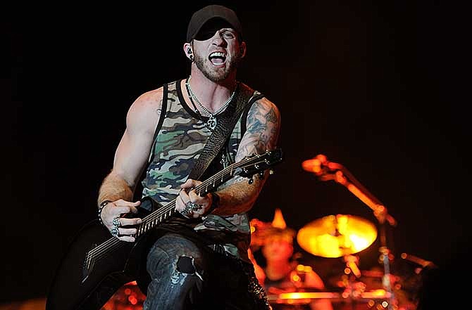 In this April 25, 2014 file photo, Brantley Gilbert performs on day one of the 2014 Stagecoach Music Festival at the Empire Polo Field in Indio, Calif. The Georgia-born singer says he is more than two years sober, but he's not giving up singing songs about drinking. 