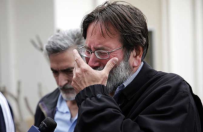 Richard Martinez who says his son Christopher Martinez was killed in Friday night's mass shooting that took place in Isla Vista, Calif., breaks down as he talks to media outside the Santa Barbara County Sheriff's Headquarters on Saturday, May 24, 2014, in Santa Barbara, Calif.