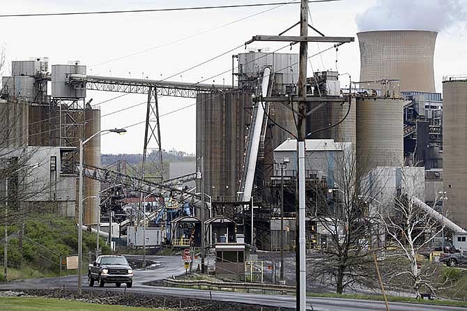 This photo taken May 5, 2014 shows a pickup truck driving down a road of the Homer City Generating Station in Homer City, Pa.