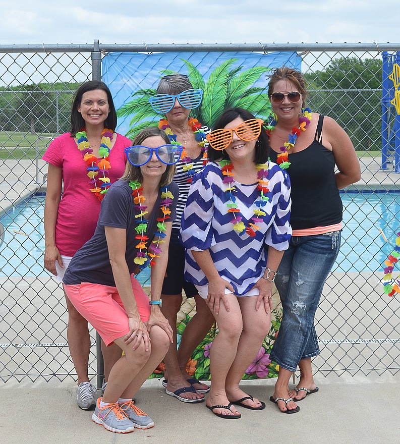 Helping out at the annual California last-day-of-school pool party May 21 at the California Country Club, front row, from left, are Kristen Everett and Julie Bolinger; back row, Kim Robertson, Pam Green, and party host Stacy Kusgen, California.  
