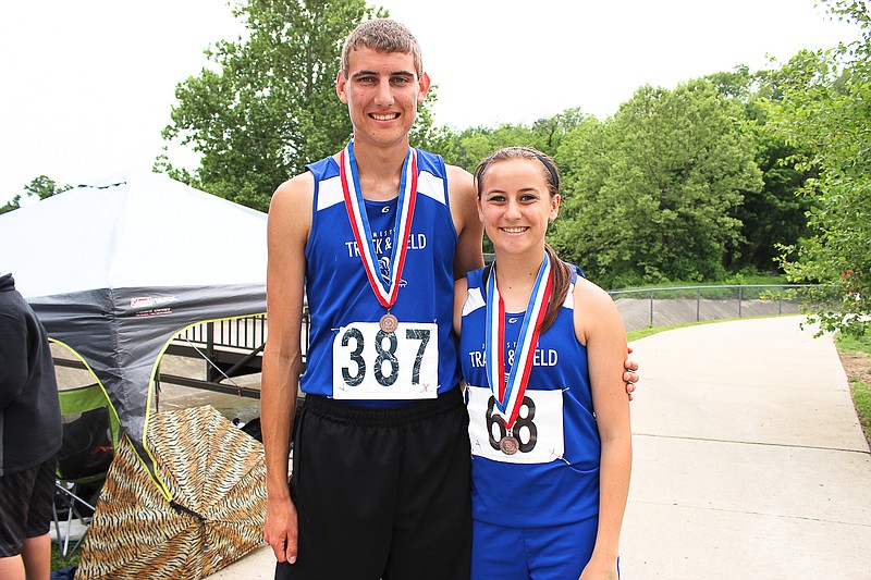 Jamestown's Trevor Barbour and Mickayla Strother proudly display the medal each received for finishing in the top eight of their event at the Class 1 state track championships Saturday, garnering All-State honors.
