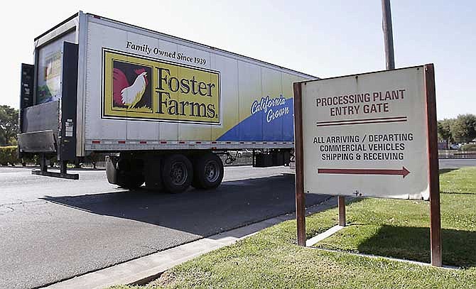 This Oct. 10, 2013 file photo shows a truck entering the Foster Farms processing plant in Livingston, Calif. An outbreak of antibiotic-resistant salmonella linked to a California chicken company is ongoing after more than a year. The federal Centers for Disease Control and Prevention says there are about eight new salmonella illnesses linked to the outbreak a week, most of them in California. So far, there has been no recall of Foster Farms chicken.