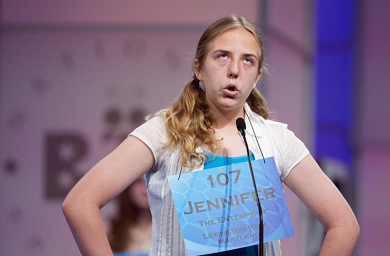 Seventh grader Jennifer M. Tennant, 13, of Father Andrew White S.J. School, Leonardtown, Md., spells her word during the preliminaries, round two of the Scripps National Spelling Bee on Wednesday at National Harbor in Oxon Hill, Md. Tennant misspelled her word. 
