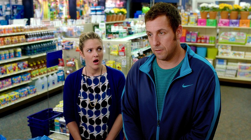 This image released by Warner Bros. Pictures shows Drew Barrymore, left, and Adam Sandler in a scene from the film, "Blended."