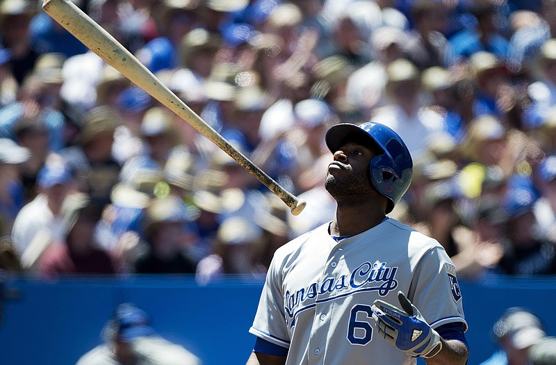 Lorenzo Cain of the Royals tosses his bat in the air after striking out during the fourth inning of Sunday's game with the Blue Jays in Toronto.
