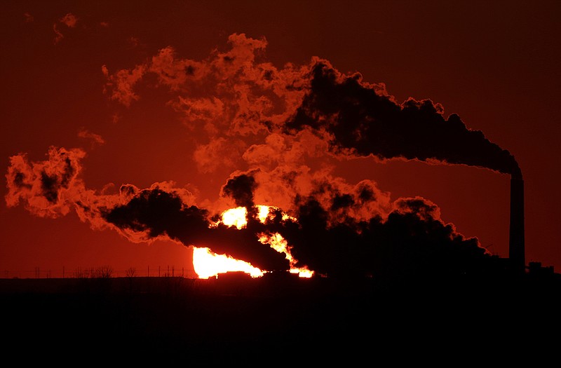 Steam pours from a Kansas coal-fired power plant.
