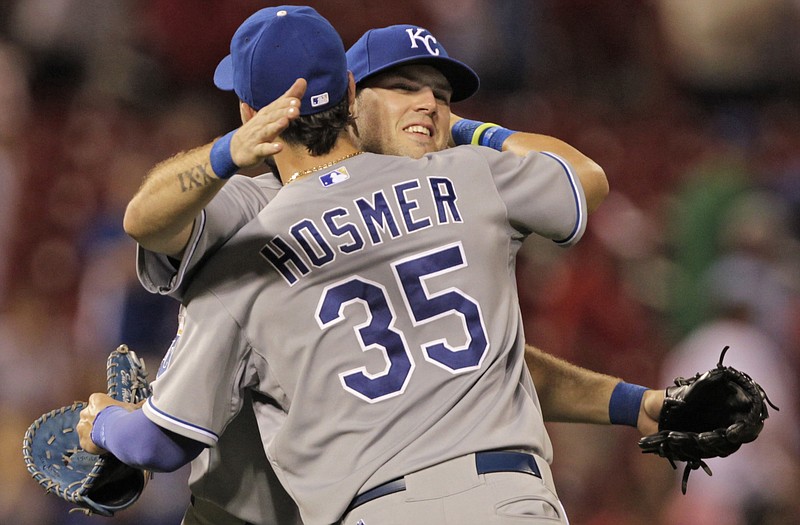 Royals teammates Eric Hosmer and Mike Moustakas celebrate after Monday night's 6-0 win against the Cardinals at Busch Stadium.