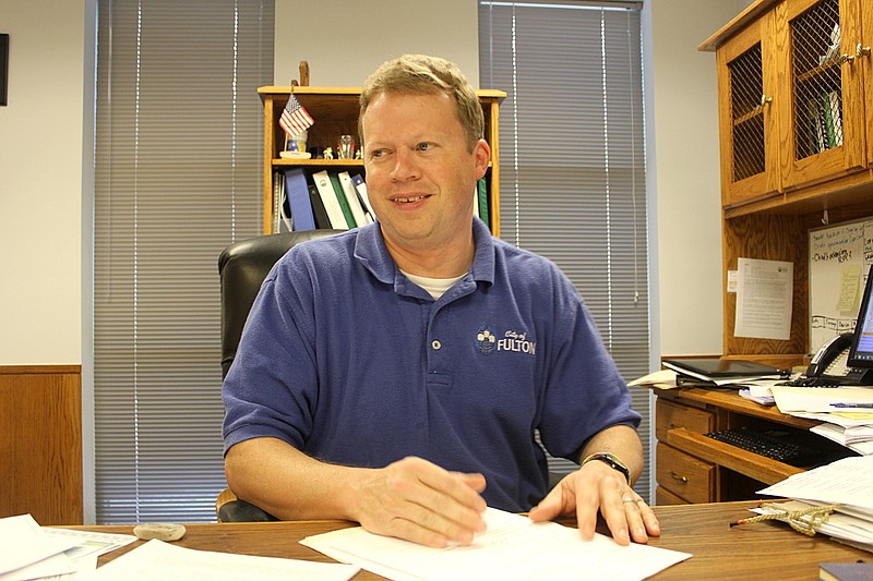 Matt Harline sits in the desk he will soon vacate. Fulton's Assistant Director of Administration of seven years will be leaving in July to take the helm in Centralia as city administrator.